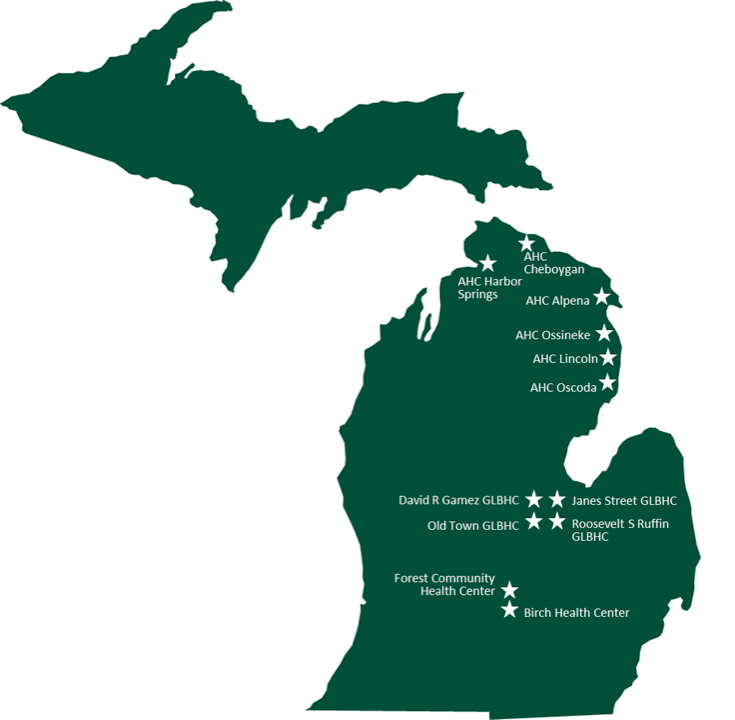 This image depicts a map of Michigan set against a white background, shaded in Spartan green. Across the map, several star symbols are distributed, marking various clinic locations. The clinics indicated include AHC Harbor Springs, AHC Cheboygan, AHC Alpena, AHC Ossineke, AHC Lincoln, AHC Oscoda, David R Games GLBHC, Old Town GLBHC, Janes Street GLBHC, Roosevelt S Ruffin GLBHC, Forest Community Health Center, and Birch Health Center. Each star symbol is shaded in white, of the same size, and serves to denote a distinct clinic location within the state.